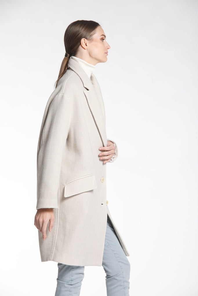 Isabel Coat is a women's woolen coat with buttons.