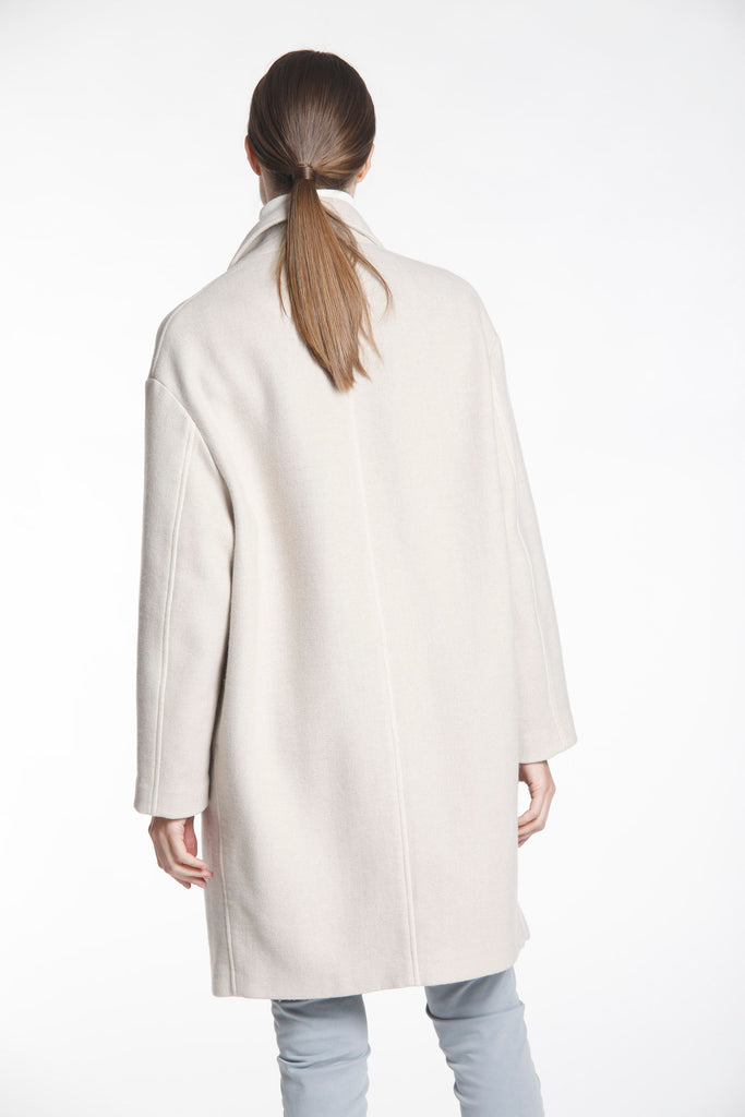 Isabel Coat is a women's woolen coat with buttons.